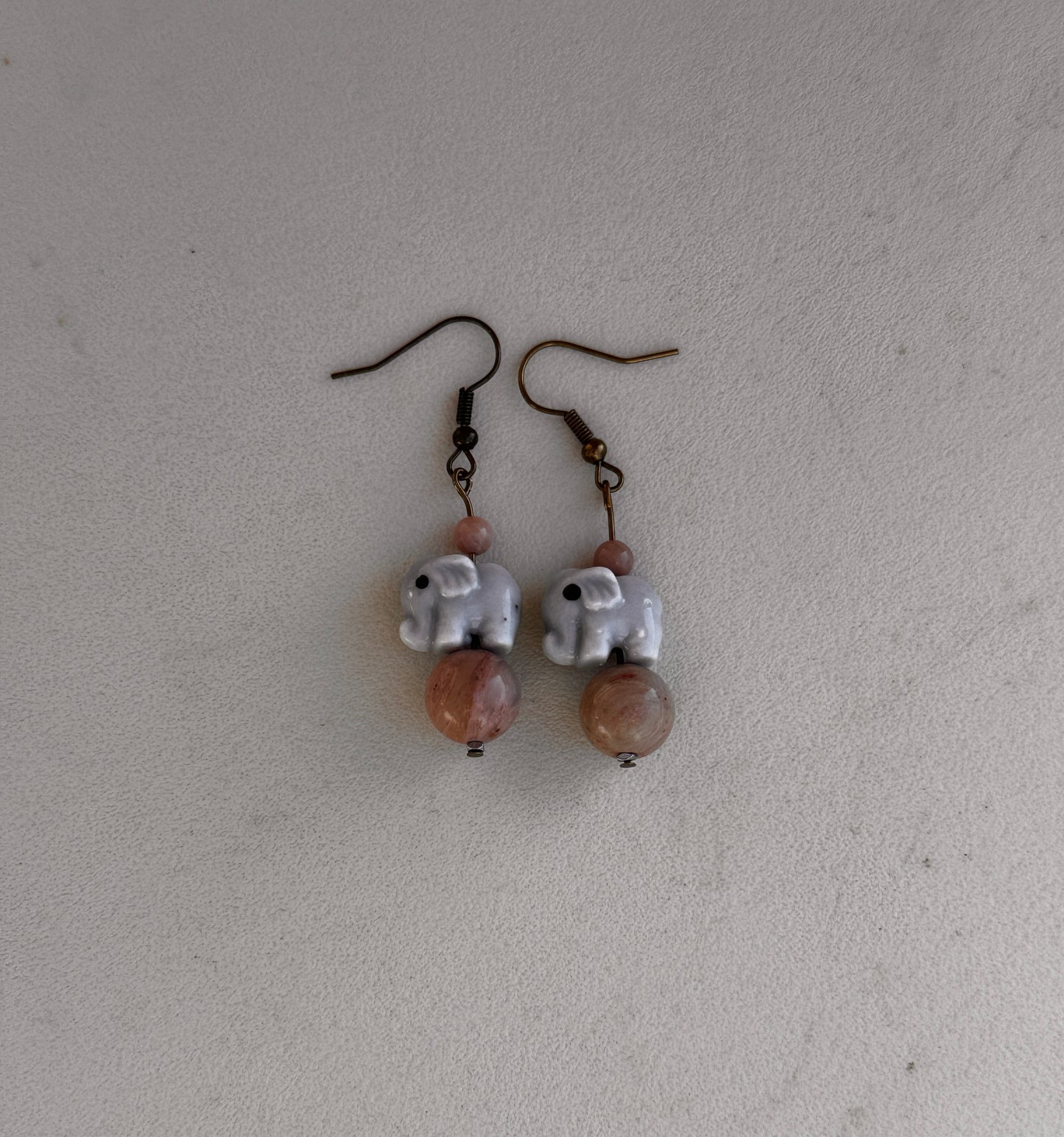 Earrings-elephant with brown bead ￼