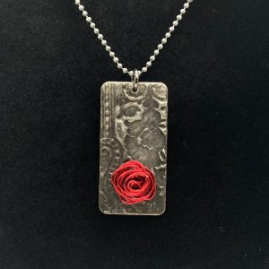 Necklace-embossed metals