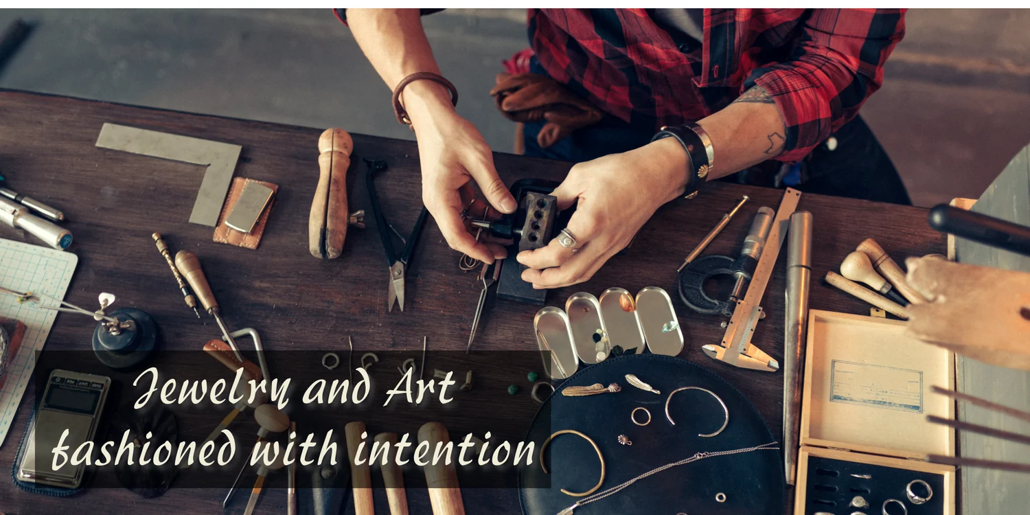 Jewelry and Art fashioned with intention — hands crafting jewelry at a workbench